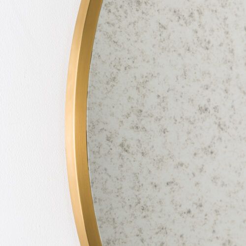 round brass mirror with aged glass