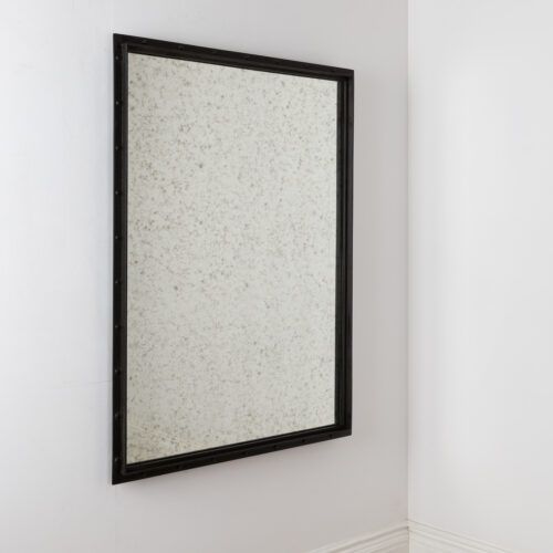 aged glass rectangular mirror with a black industrial frame ideal for hallways or living rooms