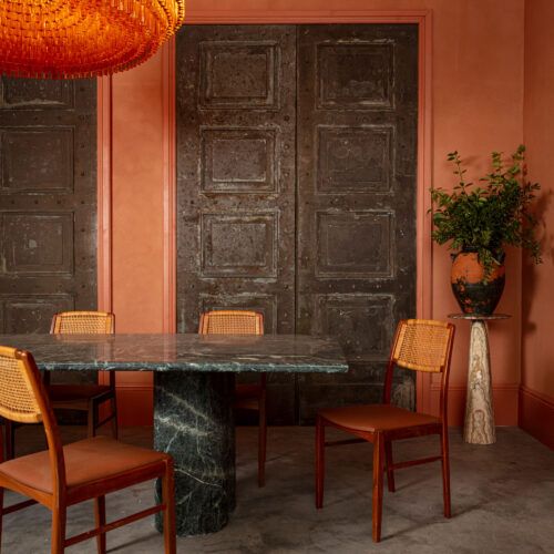 Arizone solid green marble dining table in a mid-century style